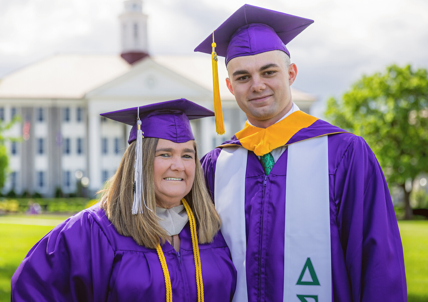 Mother, son walk across the stage on the same day