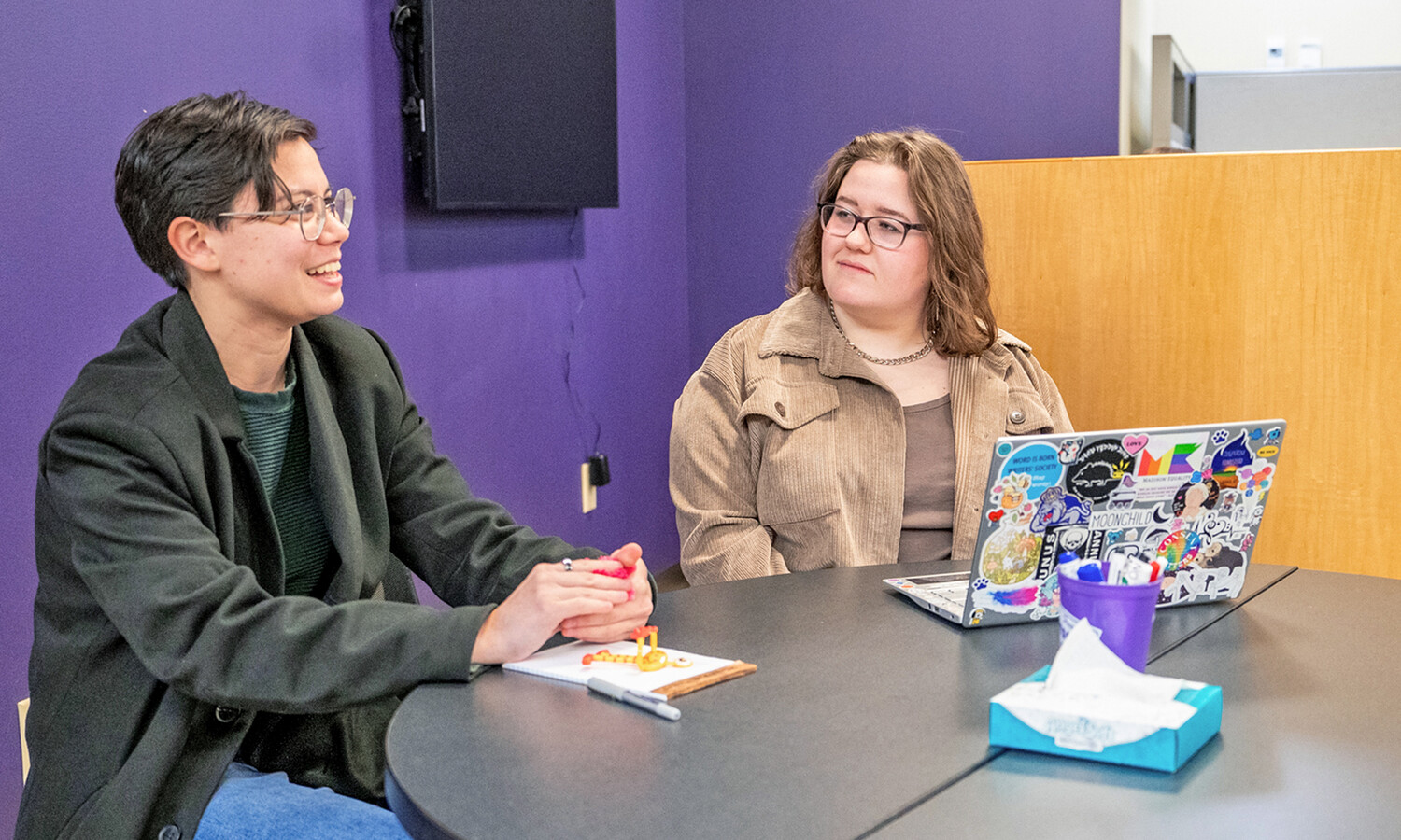 Students talking at the Writing Center